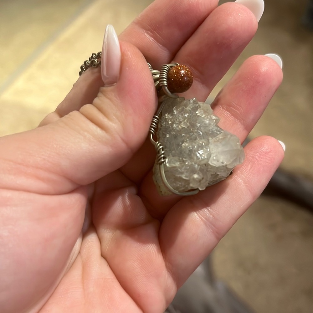 Raw quartz chunk with goldstone bead